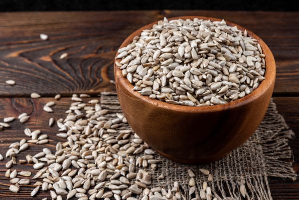 Sunflower seeds in a wooden bowl