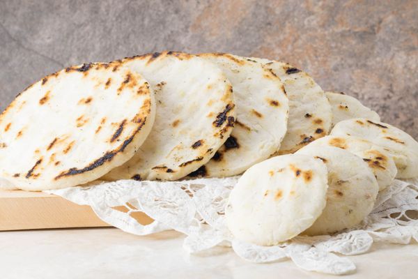 Tasty arepas con queso in different sizes