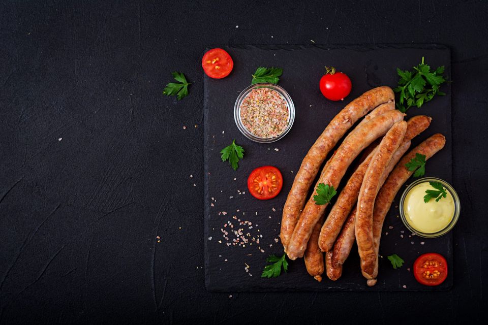 Grilled Beyond Sausage with tomatoes and greens