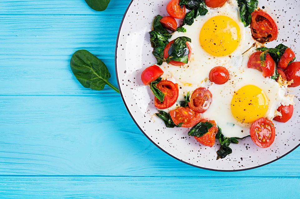 Fried egg, spinach, and cherry tomatoes