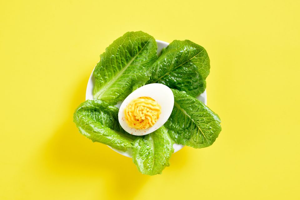 Deviled egg on vegetable leaves