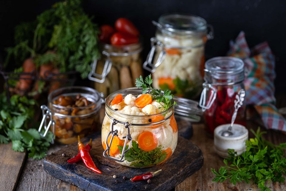 Fermented cauliflower with carrots in a glass jar