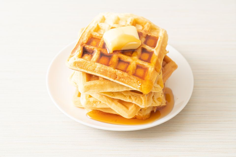 Homemade Aunt Jemima waffle with butter and honey maple syrup