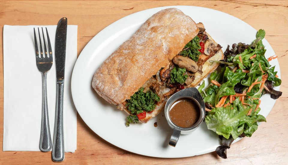 Juicy salmon cheese steak with salad and gravy