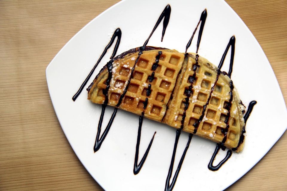Golden waffle with chocolate drizzle