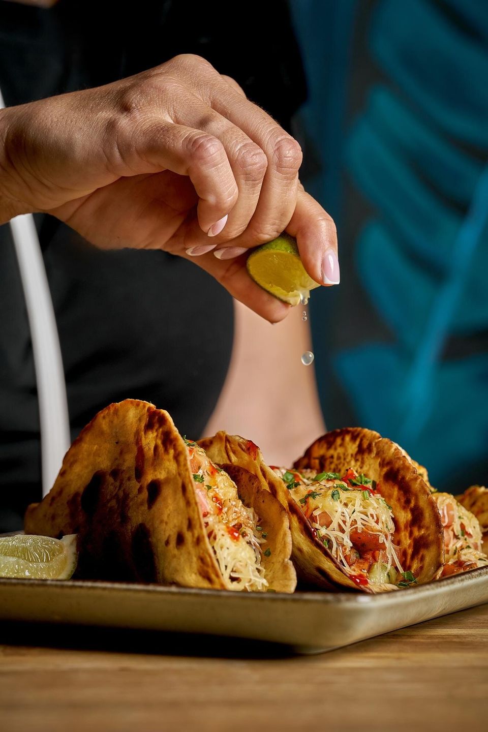 Fresh lime squeezed over tacos