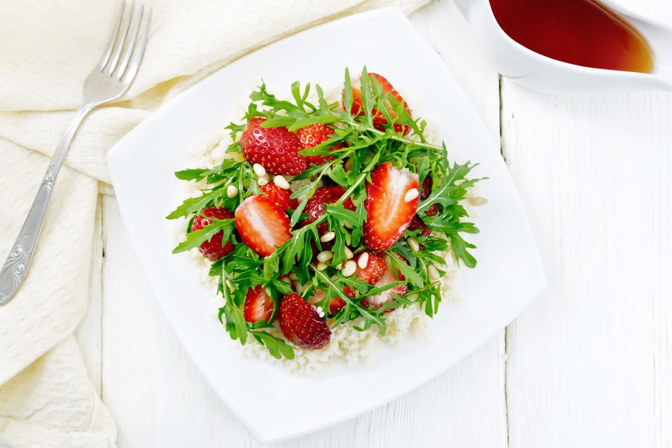 Strawberry couscous and arugula salad dressed with dry sherry