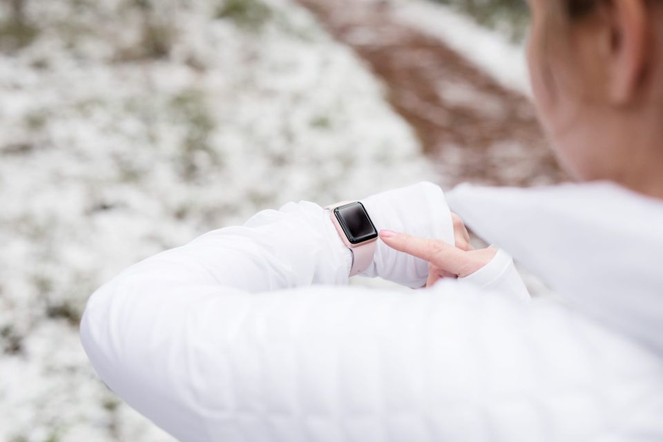 Woman checking a fitness tracker