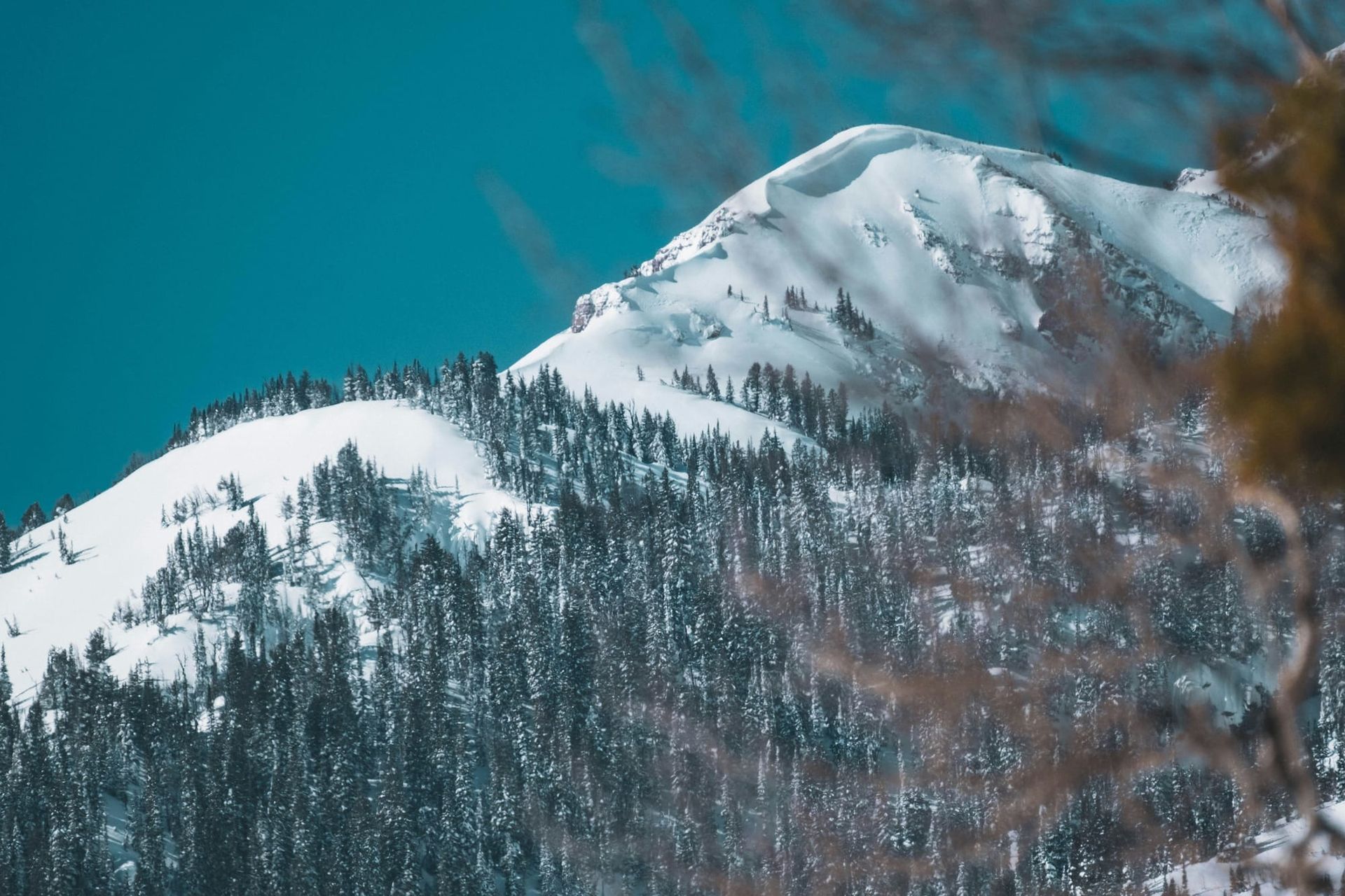 A snow-covered mountain with a large cornice in Jackson, Wyoming