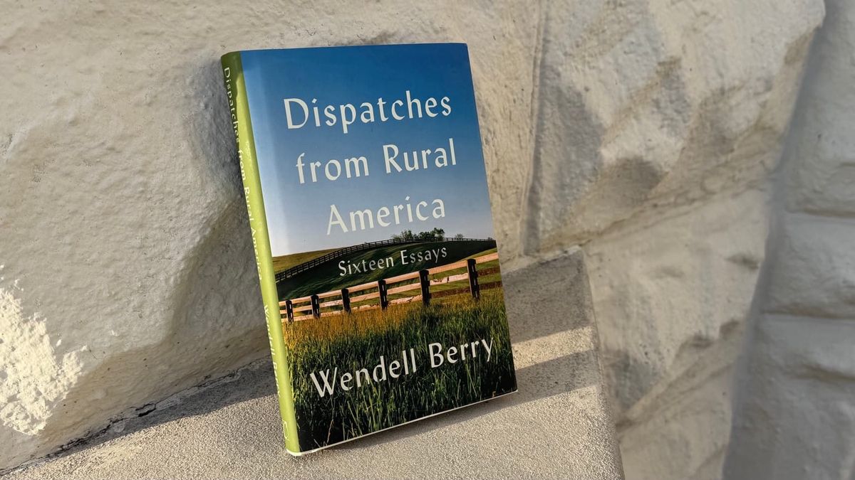 A copy of Wendell Berry’s Dispatches from Rural America: Sixteen Essays against a sunlit stone wall. (Photo by Scott P. Richert)
