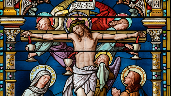 Stained glass of the Crucifixion, with Saint Mary and Saint John the Evangelist, in SS. Peter and Paul Catholic Church, Huntington, Indiana. Photo by Scott P. Richert.