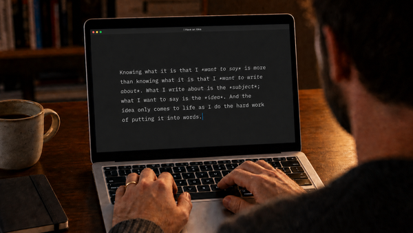 A man types on a laptop at a wooden desk beside coffee and a notebook. The screen shows a passage about putting an idea into words. (AI-generated image)