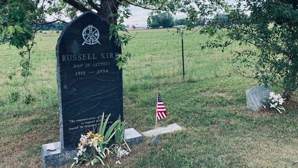 Russell Kirk’s gravestone in the cemetery at Saint Michael's Catholic Church in Mecosta County, Michigan. (Photo by Scott P. Richert)