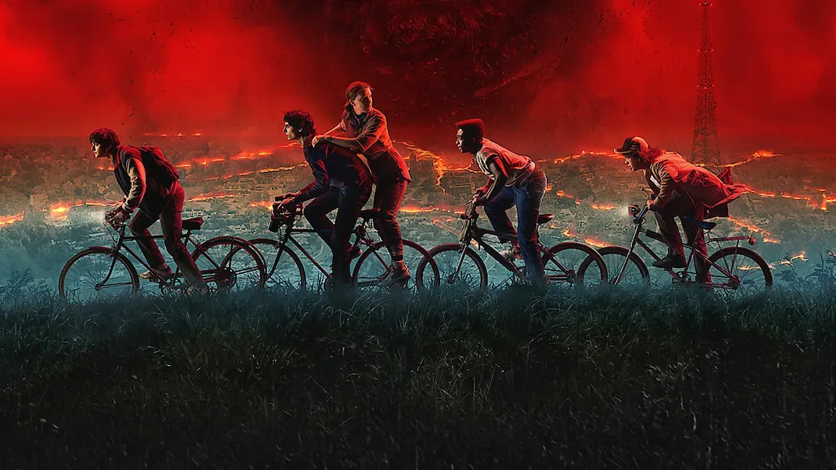Poster art for the final season of Stranger Things featuring the main cast riding their bikes across a nightmaris landscape