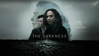 Lena Olin projected above a desolate landscape in the poster for The Darkness