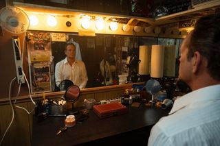 Vince Vaughn sitting in front of a dingy mirror in Easy's Waltz.