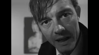 Sam Riley staring at the camera in a black and white image.