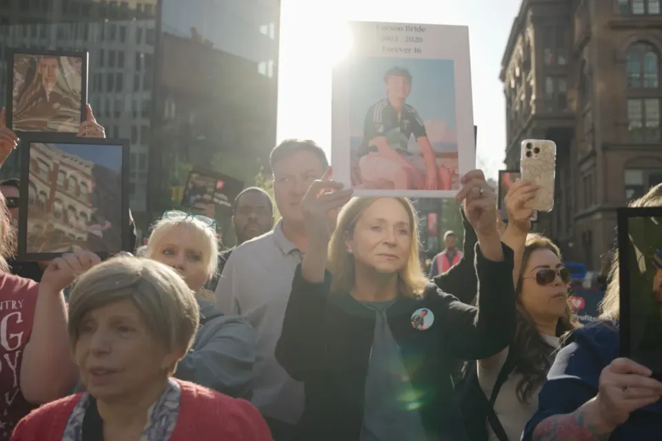 Kristen Bride marches for better online safety laws in the documentary Your Attention Please.