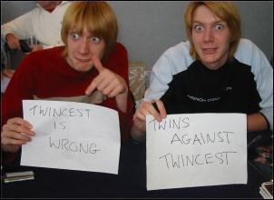  The actors who played the Weasley twins in the Harry Potter movies holding signs that read “TWINCEST IS WRONG” and “TWINS AGAINST TWINCEST.” 