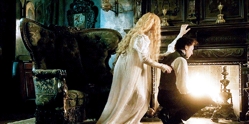  Mia Wasikowska clings to Tom Hiddleston in an animated gif from  Crimson Peak.  Everything is extremely Gothic. 
