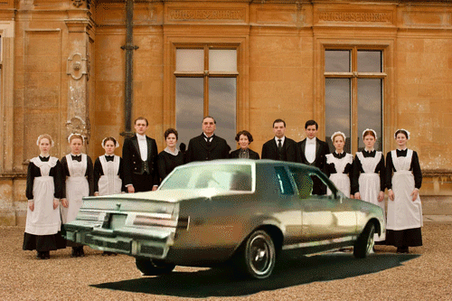  An inexplicable animated gif: the servants from  Downton Abbey  stand at attention outside the house while in front of them a 1970s car (perhaps a low rider) bounces. 