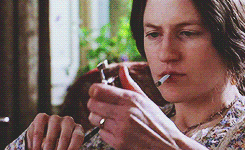  An animated gif from  The Hours : Nicole Kidman as Virginia Woolf lights a cigarette. 