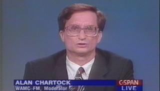  Dr. Alan S. Chartock, a man wearing very 1980s glasses. 