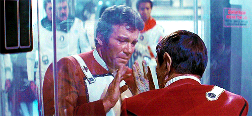  An animated gif of the moment in  Star Trek 2: The Wrath of Khan  when, dying, Spock offers Kirk the ta’al (Vulcan salute) through a pane of glass, and Kirk raises his hand to Spock’s. 