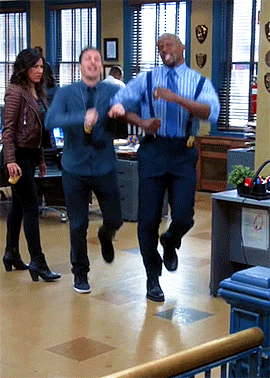  Jake Peralta and Terry Jeffords from  Brooklyn Nine-Nine  skipping through the office. 