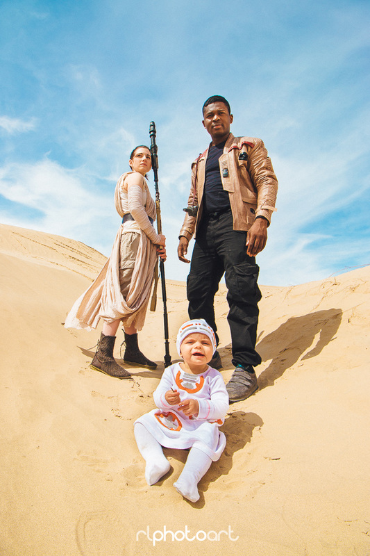  Cosplayers portraying Rey, Finn and “BaBy-8.” 