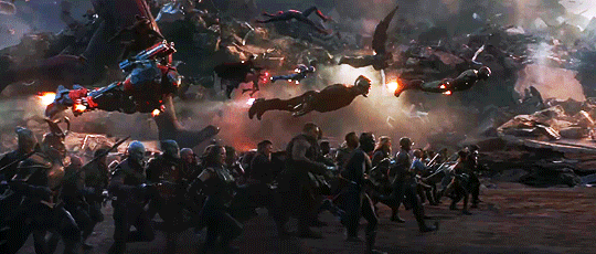 Animated gif of the final battle scene from Avengers: Endgame with bazillions of superheroes flying or running forward