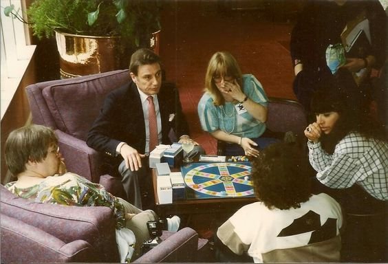 Photo of Paul Darrow playing trivial pursuit with fans.