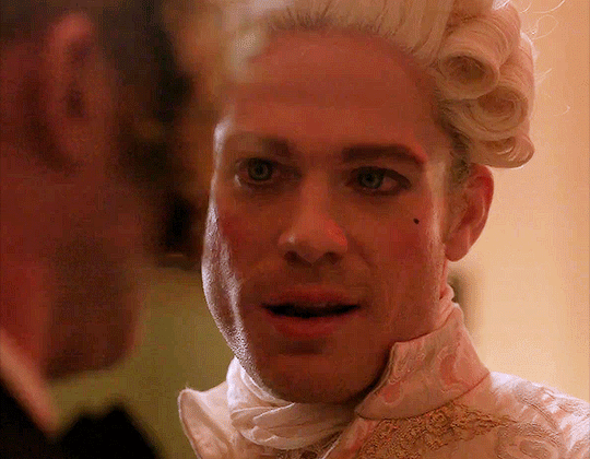 Animated gif of Lestat in 18th century costume, smiling