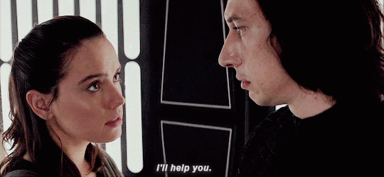 A gif: Rey says “I’ll help you” to Kylo.