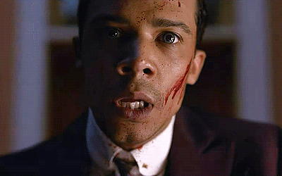 Animated gif of Louis covered in blood saying, "I'm a vampire."