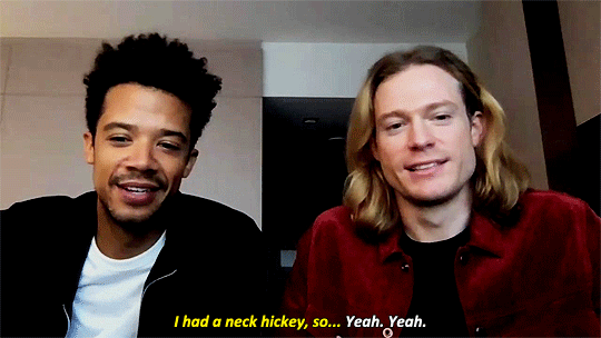 Animated gif of Jacob Anderson and Sam Reid with the caption: [Jacob] I had a neck hickey, so.... [Sam] Yeah. Yeah.