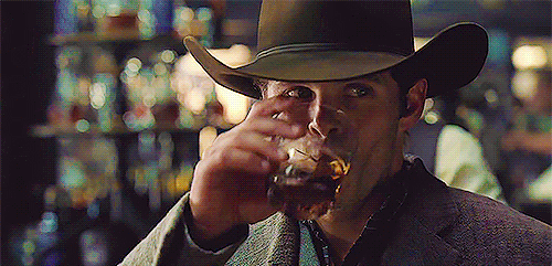Animated gif of Teddy Flood from Westworld sipping a drink
