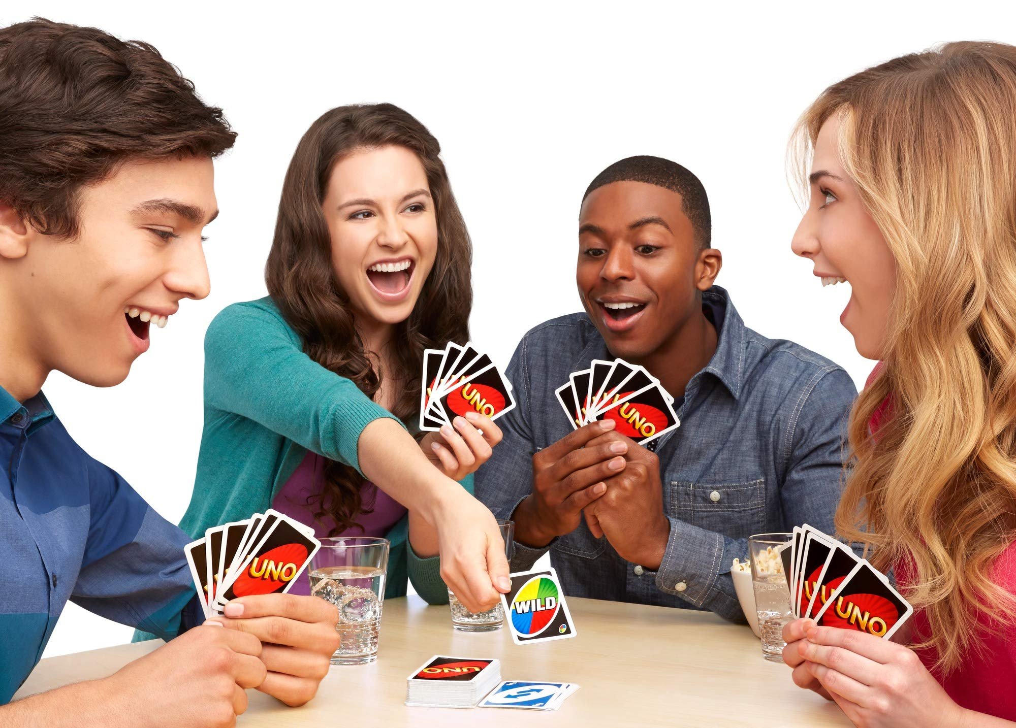 Photograph of four people playing Uno