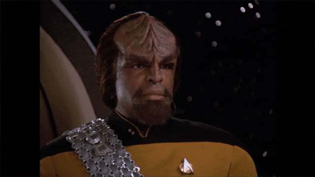 Animated gif of Worf from Star Trek: The Next Generation, rolling his eyes
