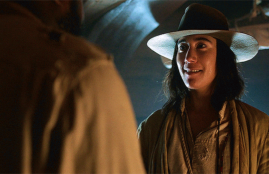 Animated gif of Jim and Oluwande from Our Flag Means Death kissing.