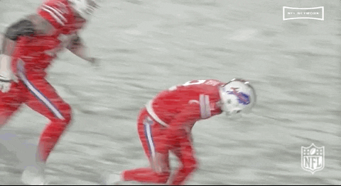 Animated gif of several Buffalo Bills in their natural habitat, sliding on a snow-covered field