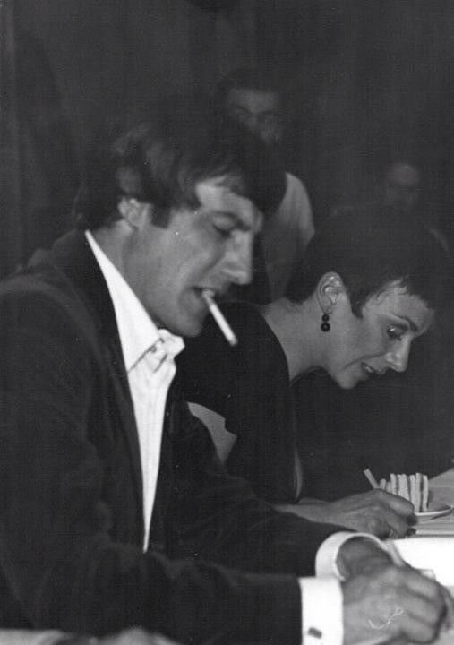 B&W photo of Darrow and Jacqueline Pearce signing autographs.