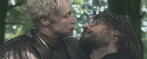 An image of Brienne cradling Jaime and looking angry.