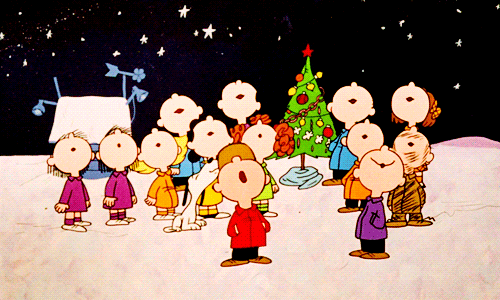 Animated gif from the Charlie Brown Christmas special with the whole cast singing while looking up at the sky