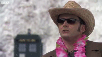 Animated gif of the Tenth Doctor on the snowy Ood planet turning to shut the TARDIS like you would lock a car remotely, then turning back to an Ood.