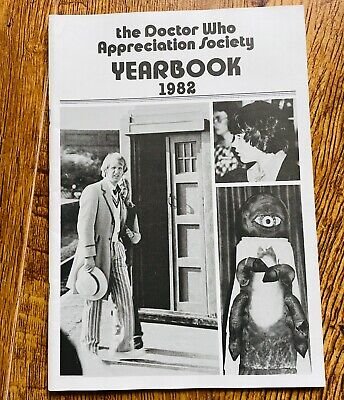 Photograph of "the Doctor Who Appreciation Society Yearbook 1982" with several images including the 5th Doctor
