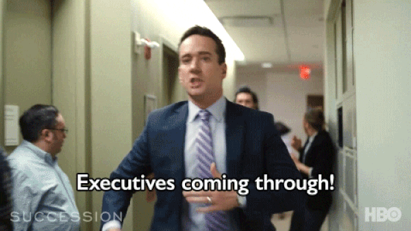  A  Succession gif with Tom and Greg running: “Executives coming through!” 