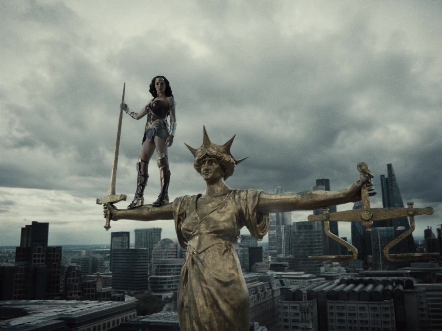  Snyder’s image of Wonder Woman standing on a statue. It is very grey-toned and in 4:3. 