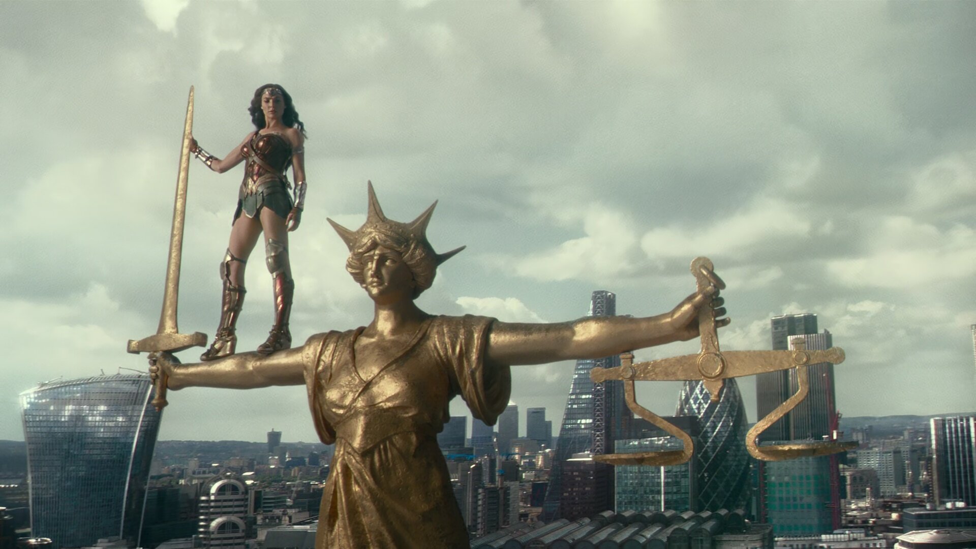  Whedon’s version of the same image. He has made it brighter, added skyscrapers in the background and made the statue very shiny. 