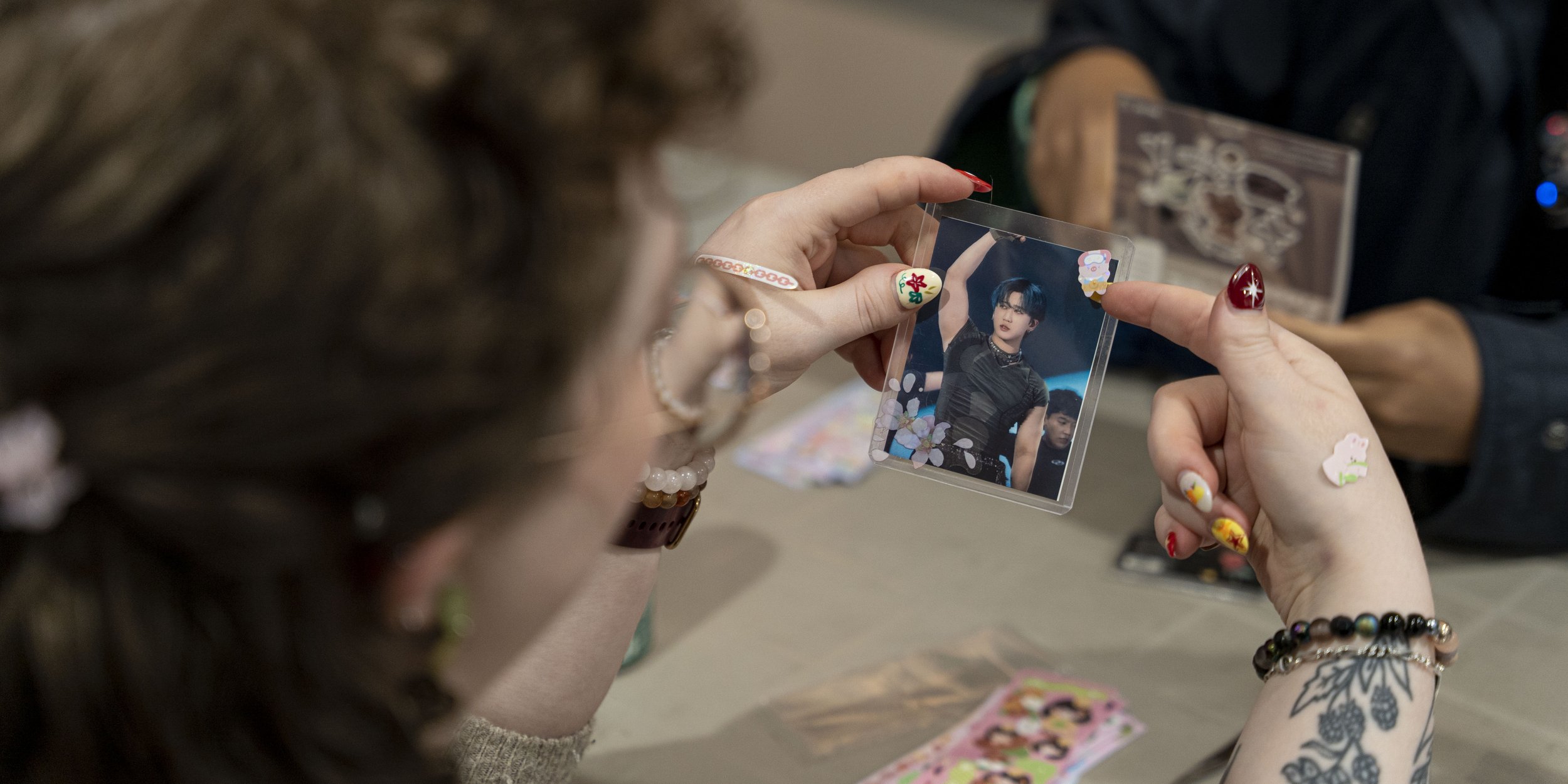 Image of a person holding a photo card.